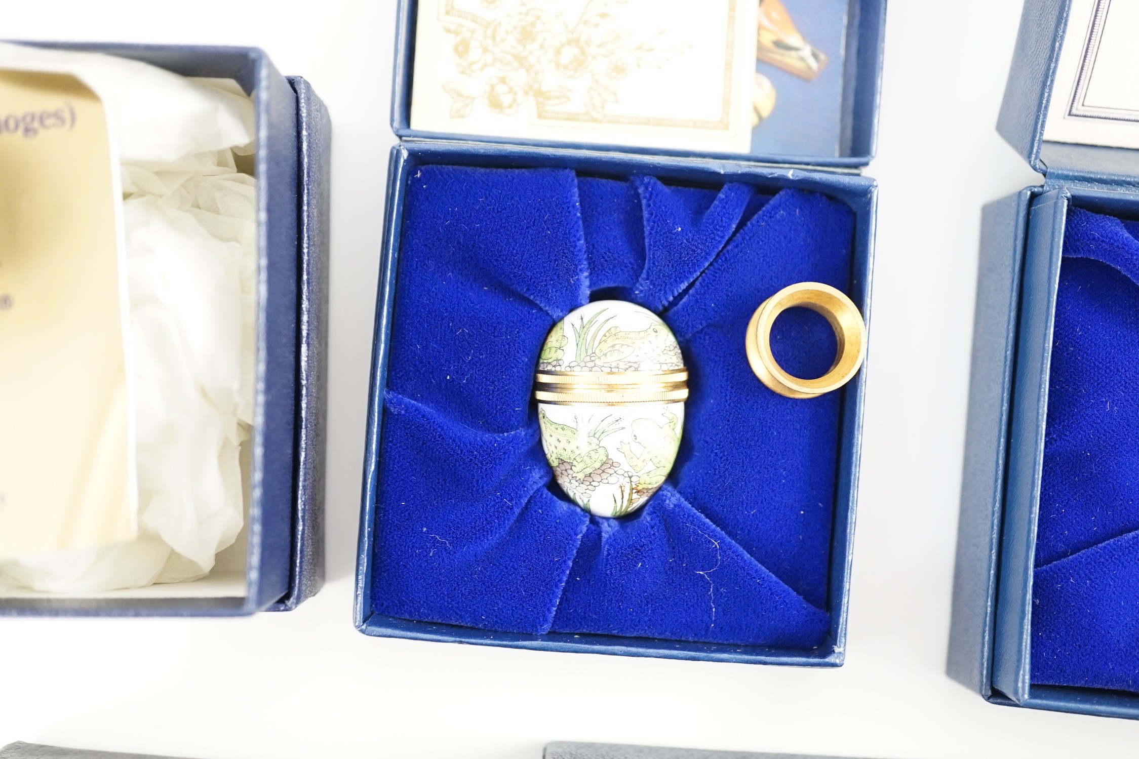 Two Halcyon Days enamel boxes; frog and 1991, two Dubarry boxes and a white metal model elephant, all boxed.